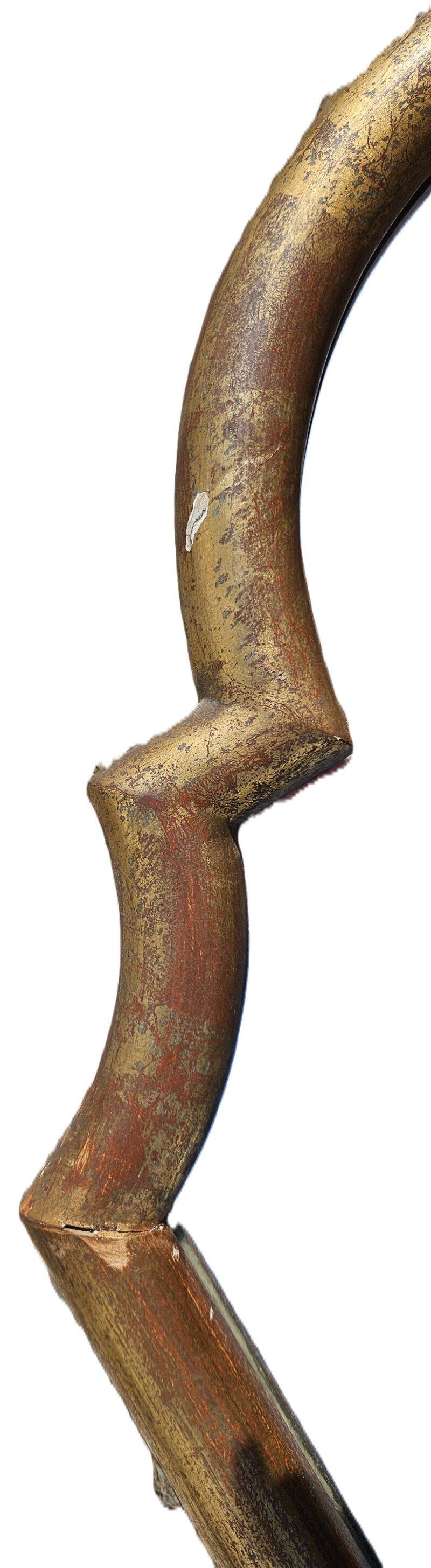 Large gilded wooden mirror in the shape of a gendarme hat