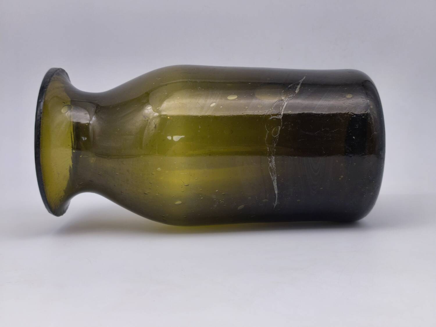 Old olive green blown glass mushroom jar, decorative object.