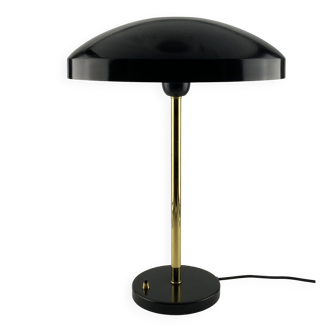 Rare black and gold UFO table lamp by Louis Kalff for Philips.