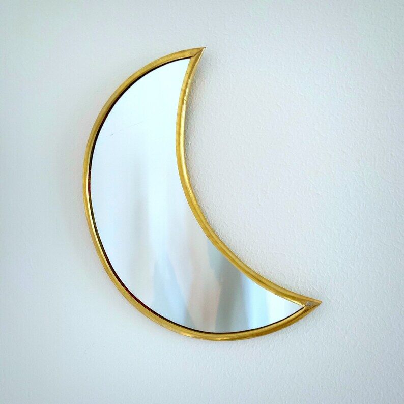Moon-shaped gilded brass wall mirror, 24x9 cm