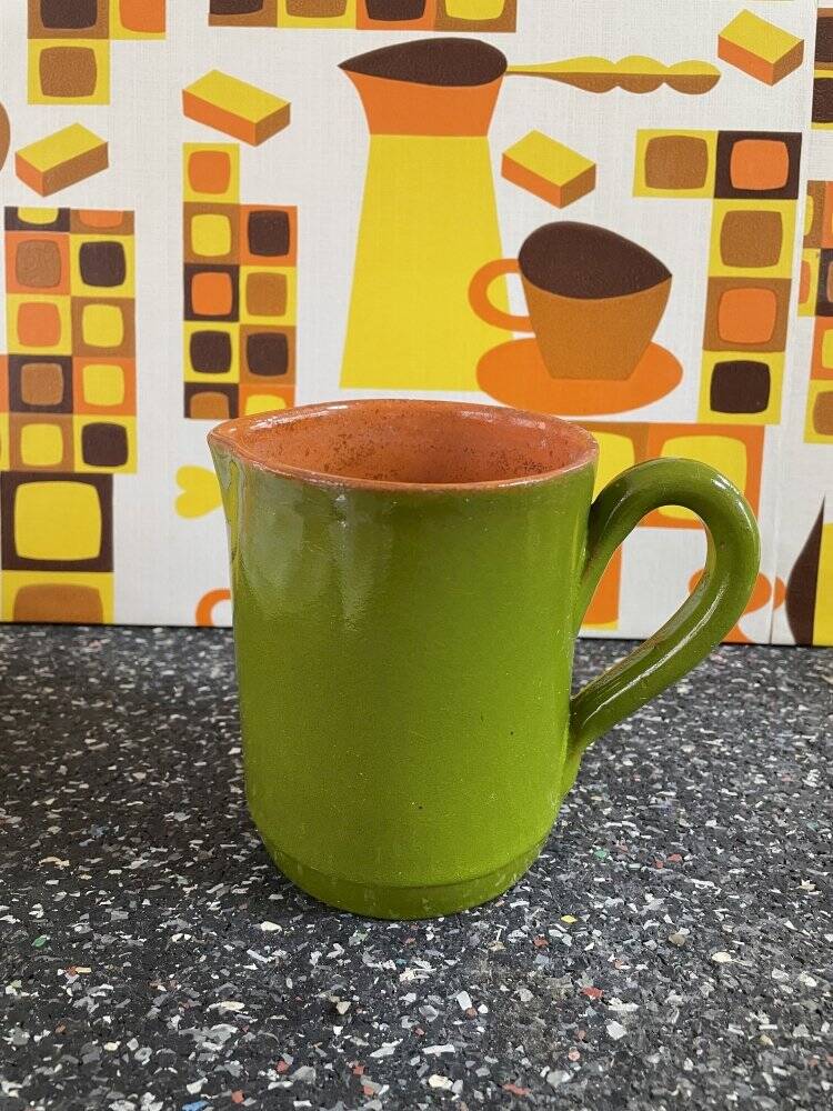 Small two-tone green glazed terracotta jug, height 12 cm.
