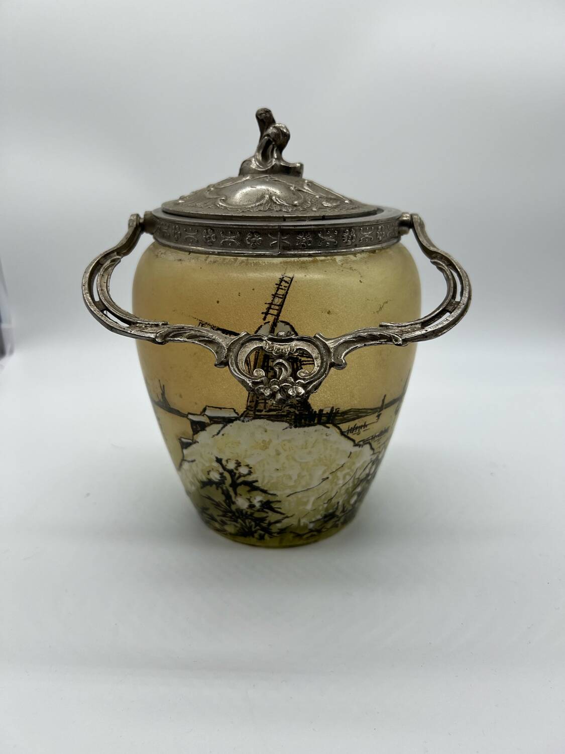 Old enameled glass cookie jar with mill decor