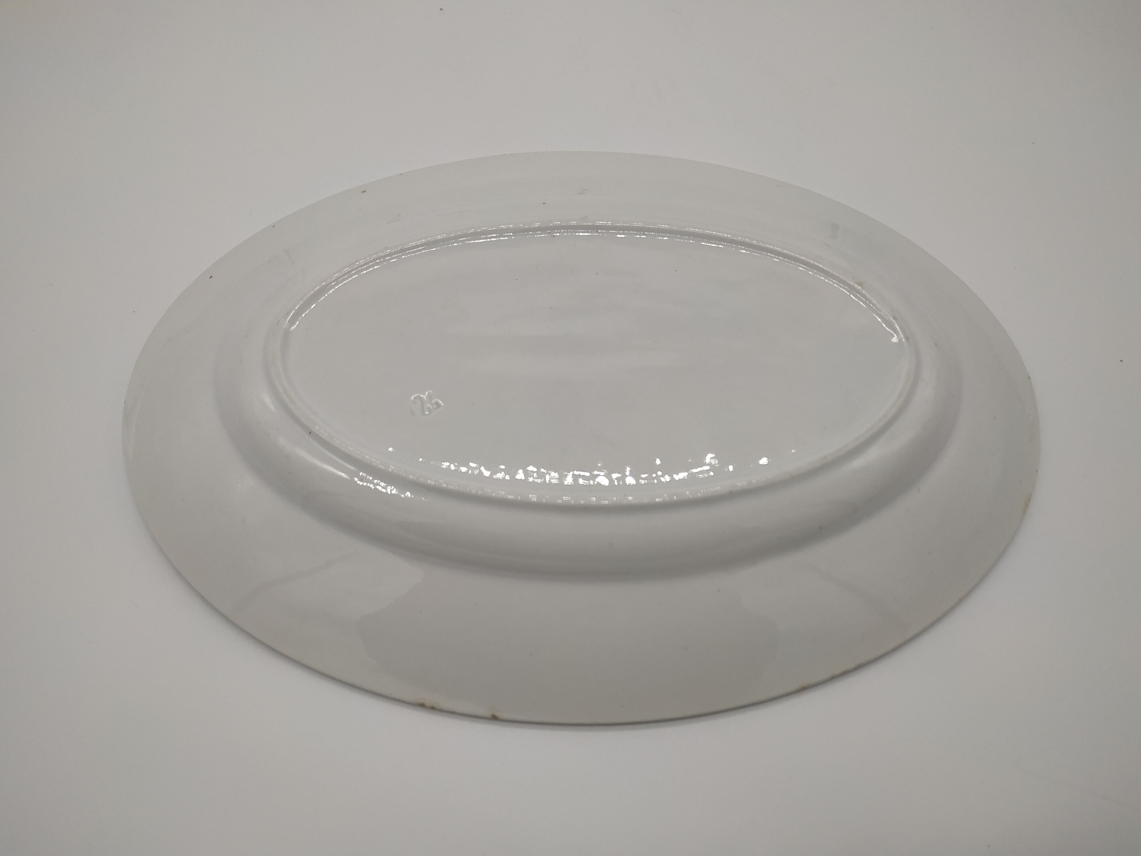 Vintage oval dish decorated with blue bouquet