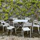 Garden furniture in wrought iron and wooden slats composed of two armchairs, 4 chairs and a table.