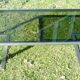 Table basse 1960 métal et verre fumé