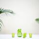 Carafe en verre vert moulé aux motifs de fruits orangeade avec ses 6 verres