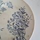 Set of 6 flat plates plus one earthenware dish.