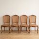 Set of 4 Regency chairs in caned cherry wood.
