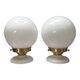 Pair of wall sconces with white opaline globes