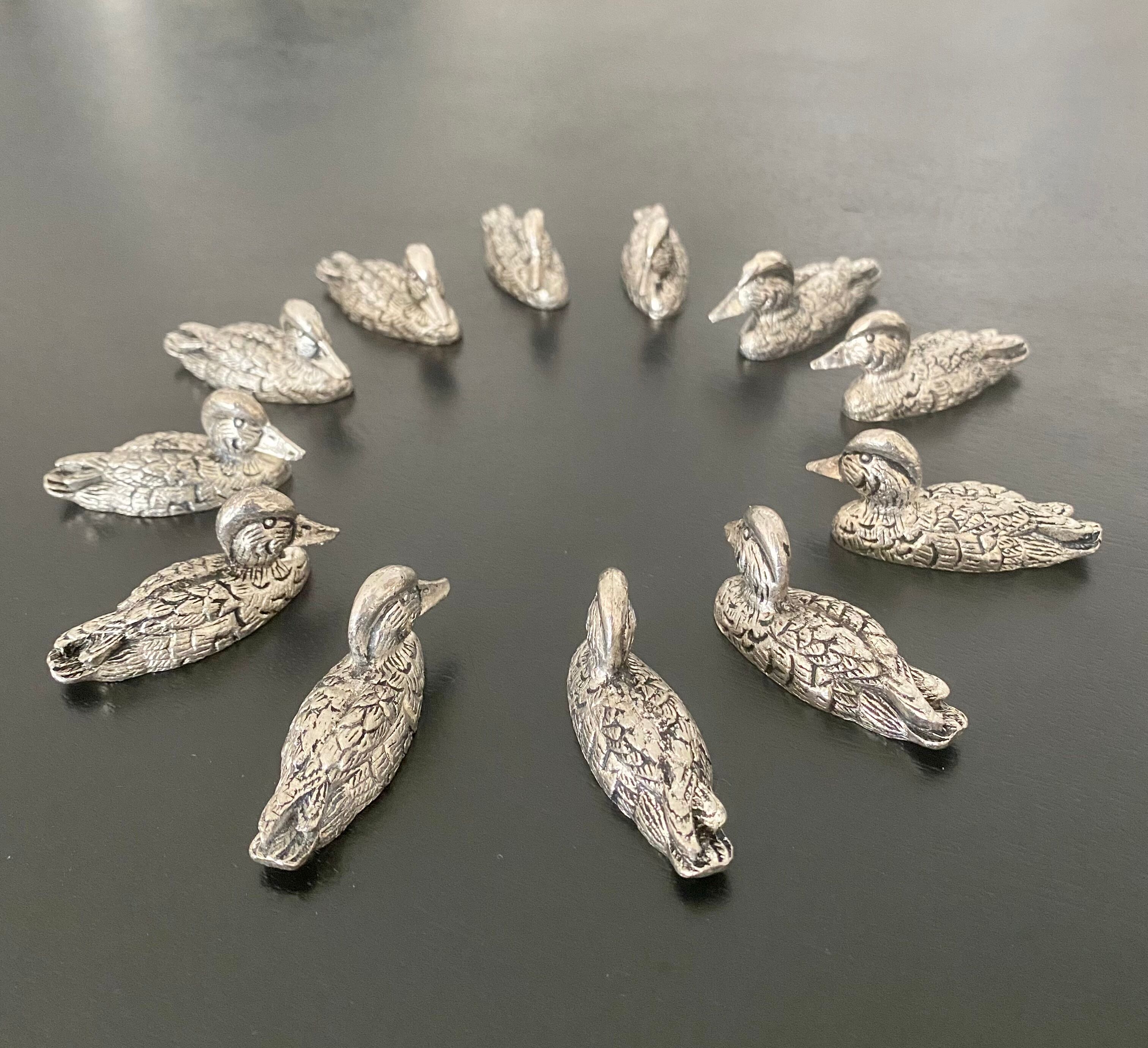 12 metal duck-shaped knife holders