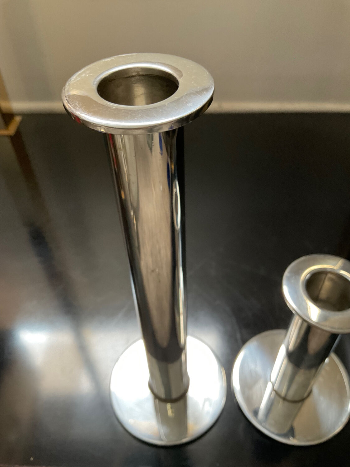 Duo of vintage candle holders in silver metal