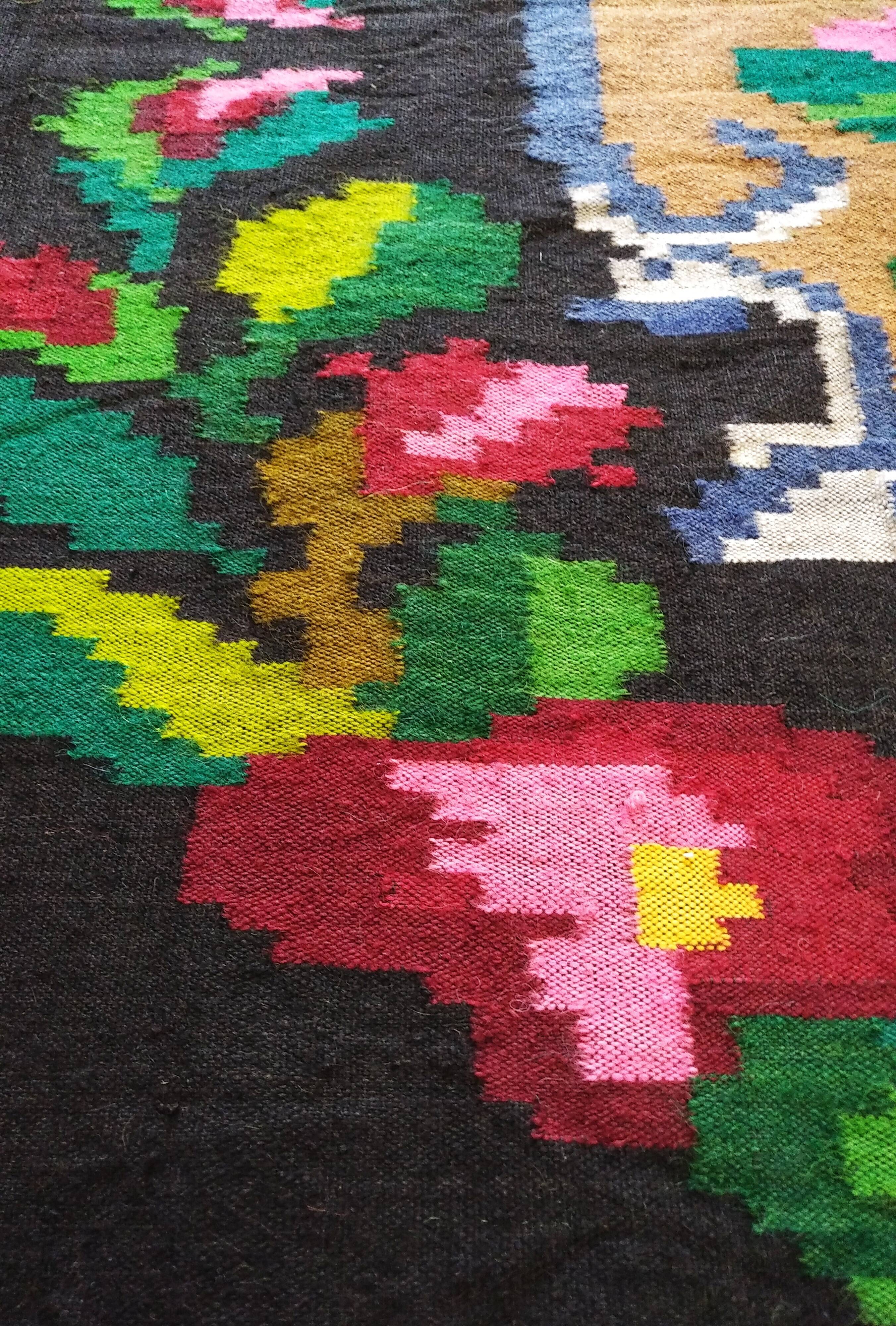 Romanian floral runner rug on blue background