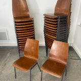 Set of 33 stackable wooden chairs 70s, origin Germany.