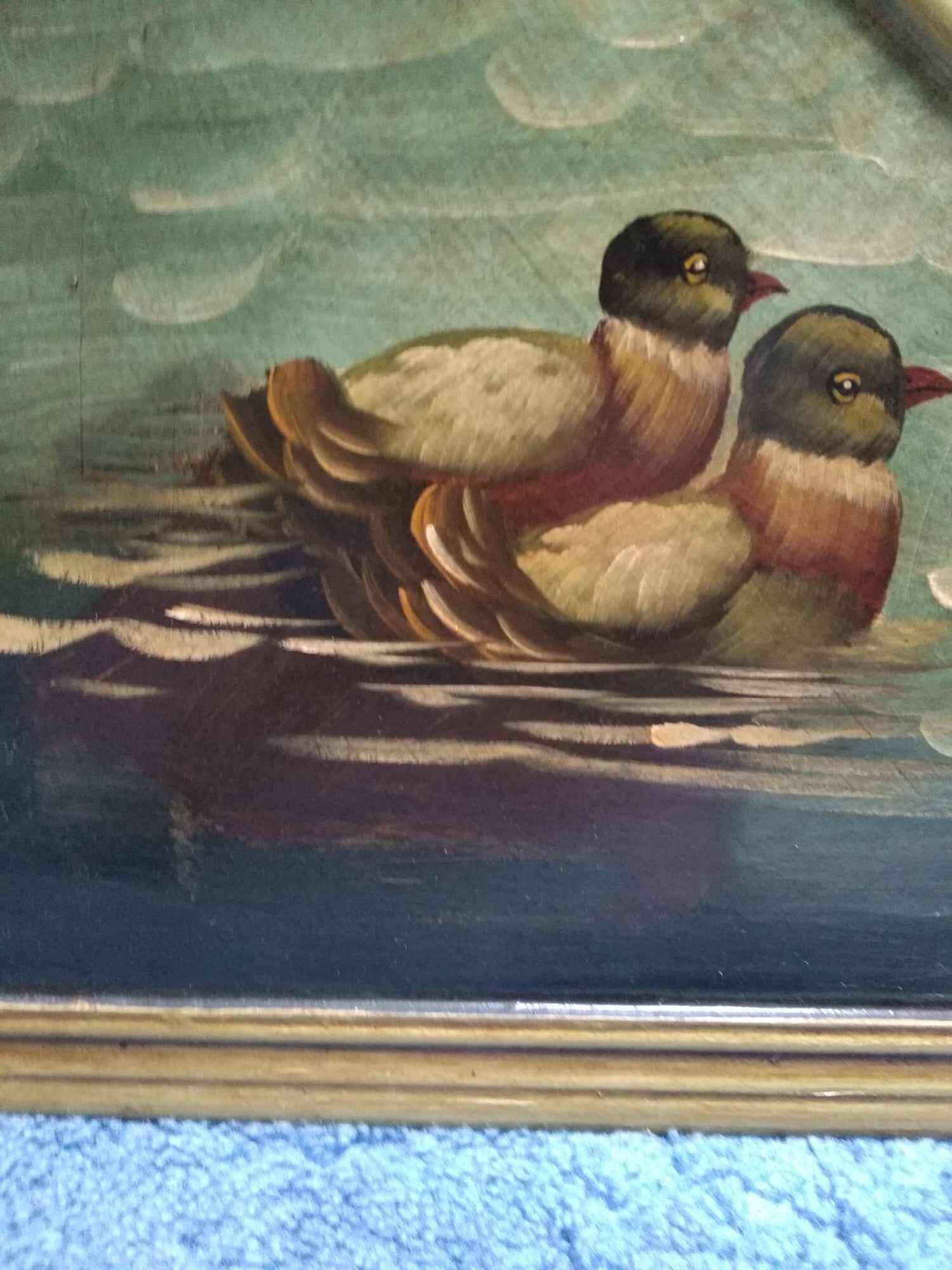 Oval mirror in duck pattern frame