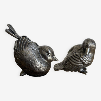 Couple d’oiseaux en métal ciselé