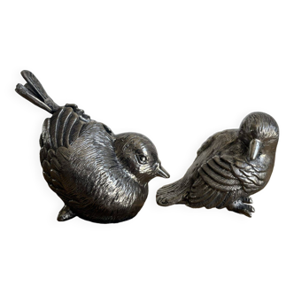 Couple of chiseled metal birds