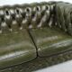 Three-seater green leather Chesterfield sofa
