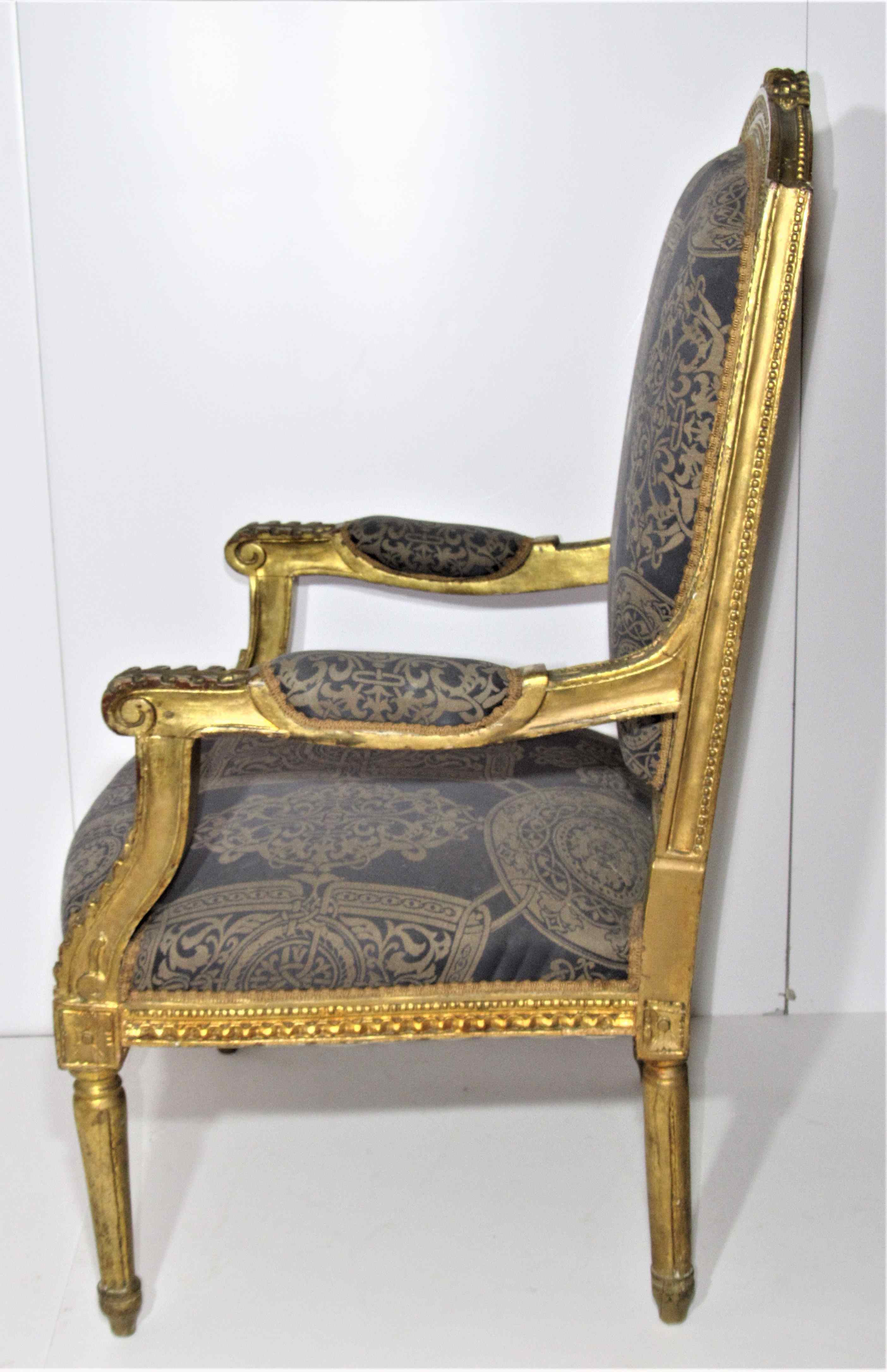 4 armchairs and a gilded wooden sofa Louis XVI style