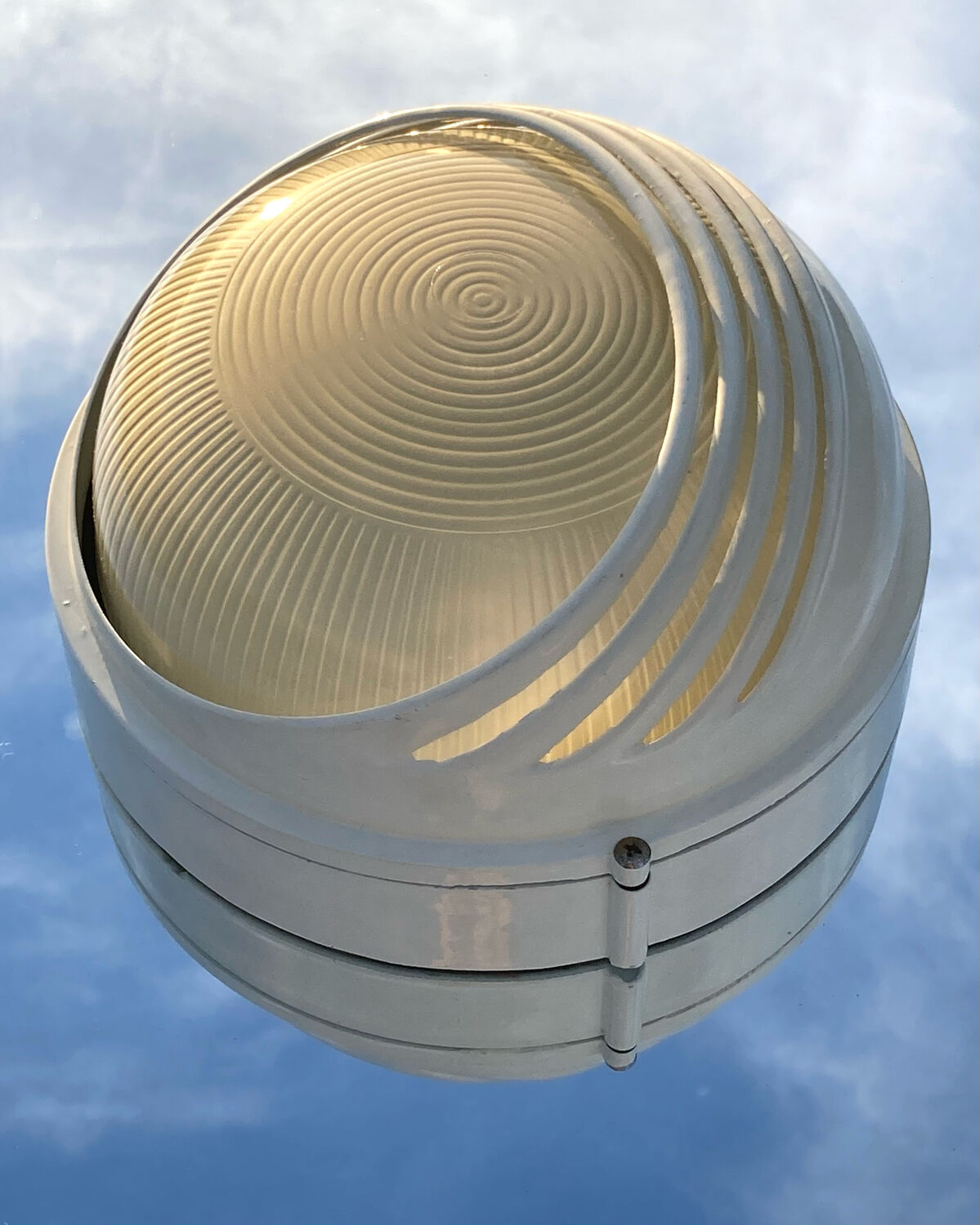 Designer metal wall light