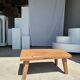 Coffee table in blond teak quadripod