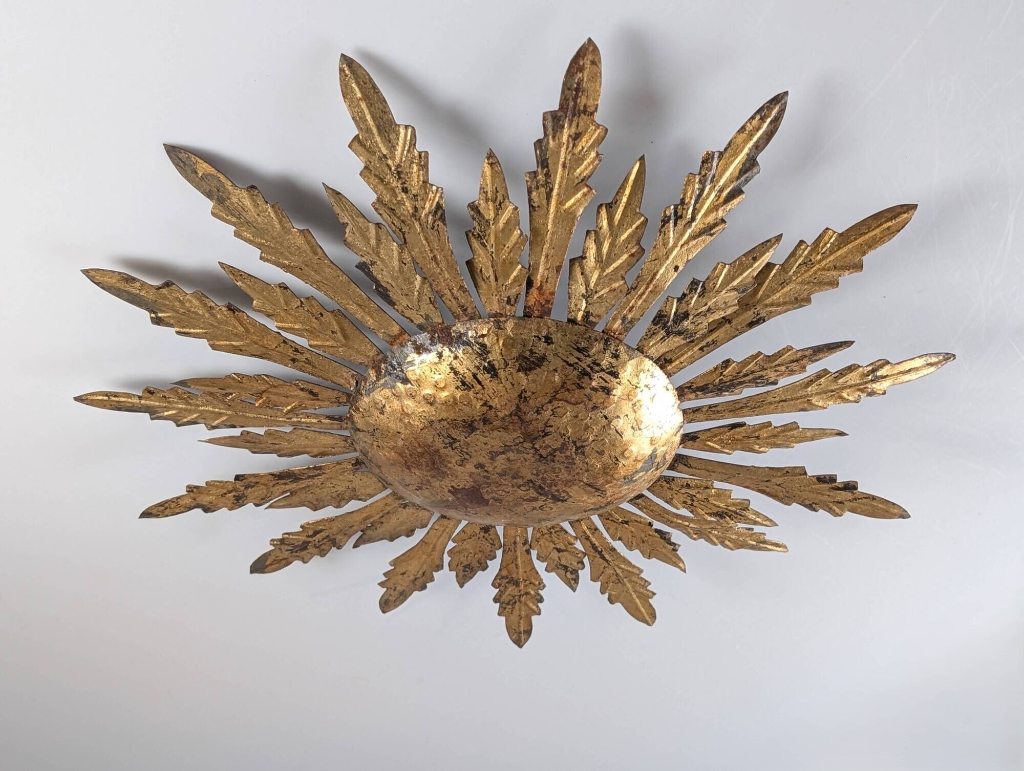 Mid-century sun ceiling lamp in gilded metal with leaf rays, 1950s