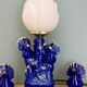 Vintage blue ceramic lamp with its birds.