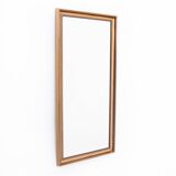Mirror in a gold frame.