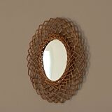Sun mirror in woven rattan. 1960.