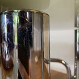 Table basse chrome et verre fumé ovale années 70