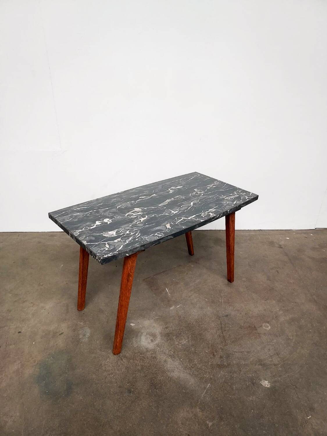 Marble effect Formica coffee table - flared legs