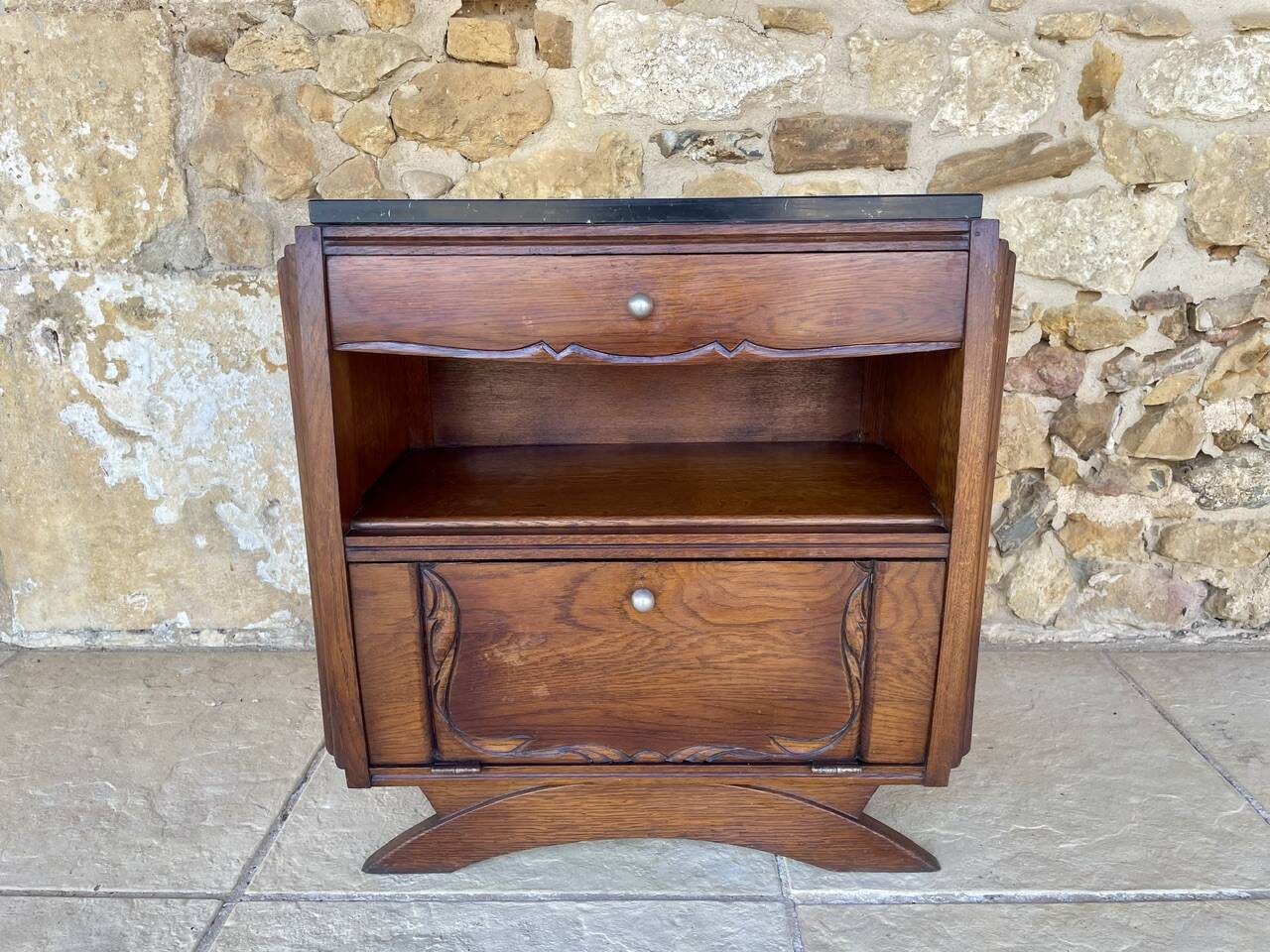 Art Deco bedside table in walnut, black marble top, circa 1920.
