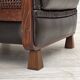 Fauteuil scandinave années 1970, cuir d'ameublement marron, pieds en bois de teck.