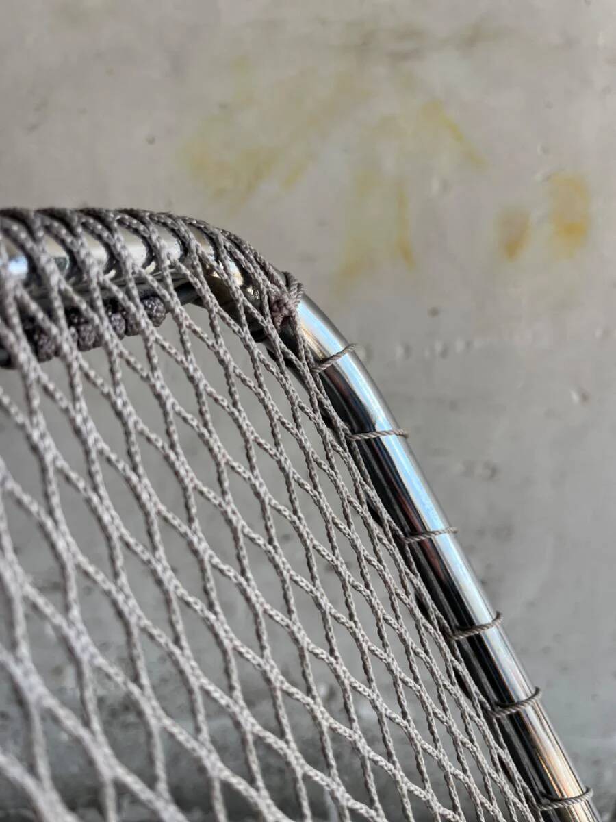 Pair of vintage silver aluminum wire folding chairs with wooden armrests — industrial minimalist