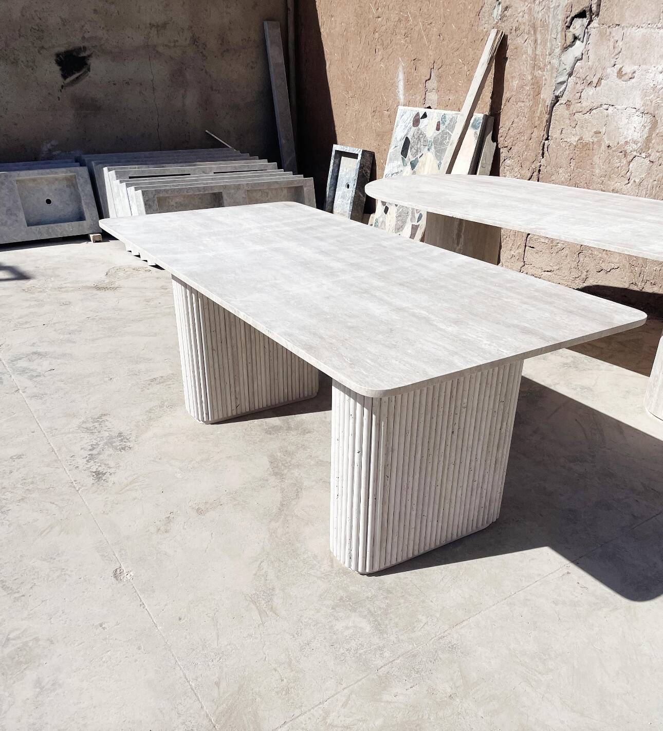 Dining table in travertine