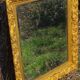 Wooden mirror decorated with gold from the 1920s