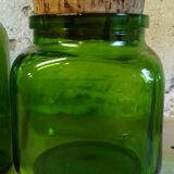 Trio of green glass apothecary bottles