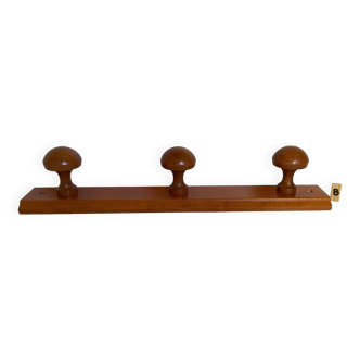 Coat rack hooks in the shape of wooden mushrooms