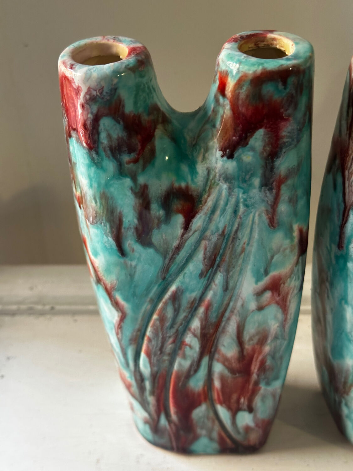 Vintage pair of turquoise and red ceramic candlesticks