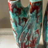 Vintage pair of turquoise and red ceramic candlesticks