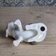 Small spaniel dog in porcelain