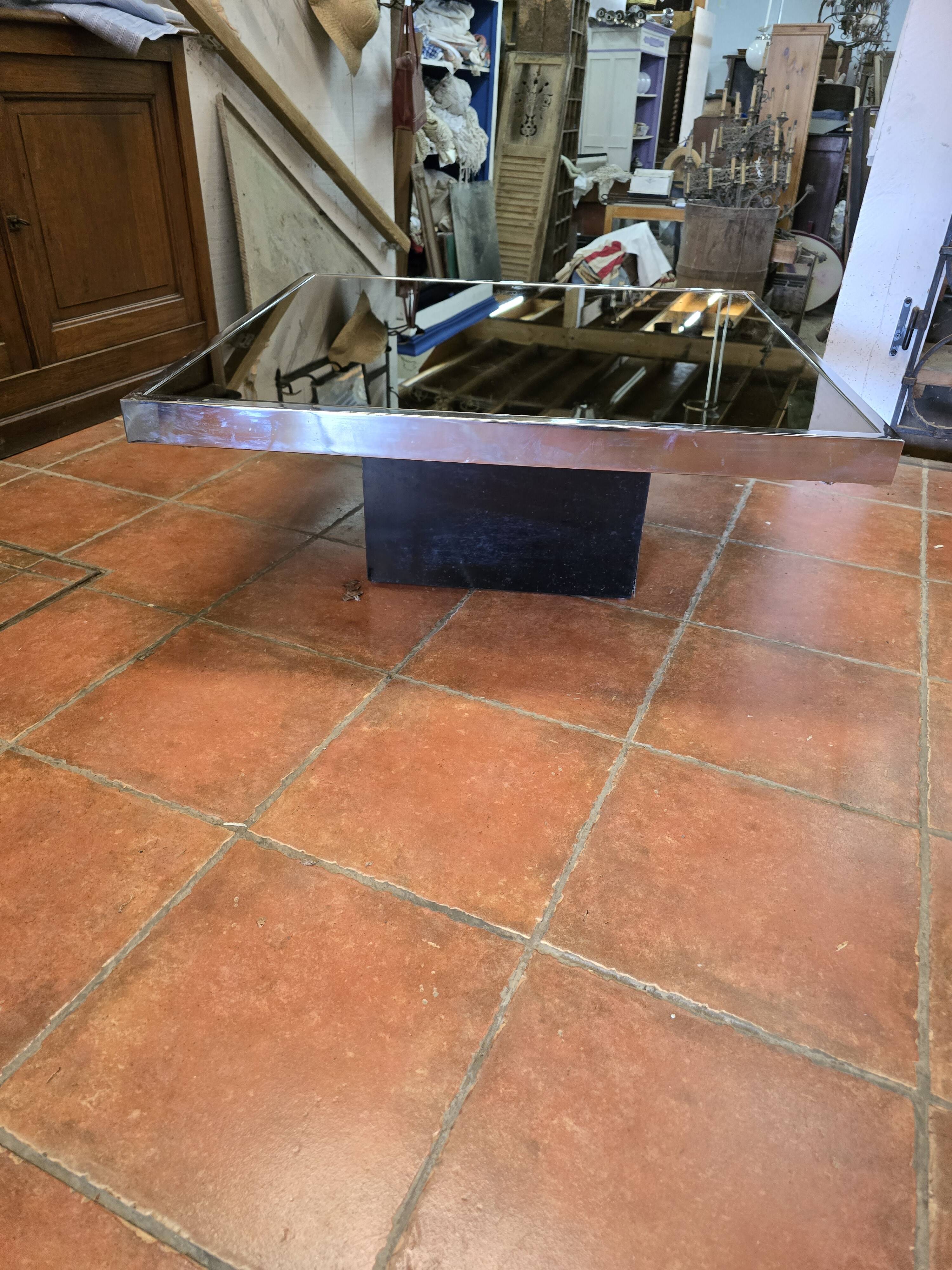 Chrome coffee table with smoked mirror top
