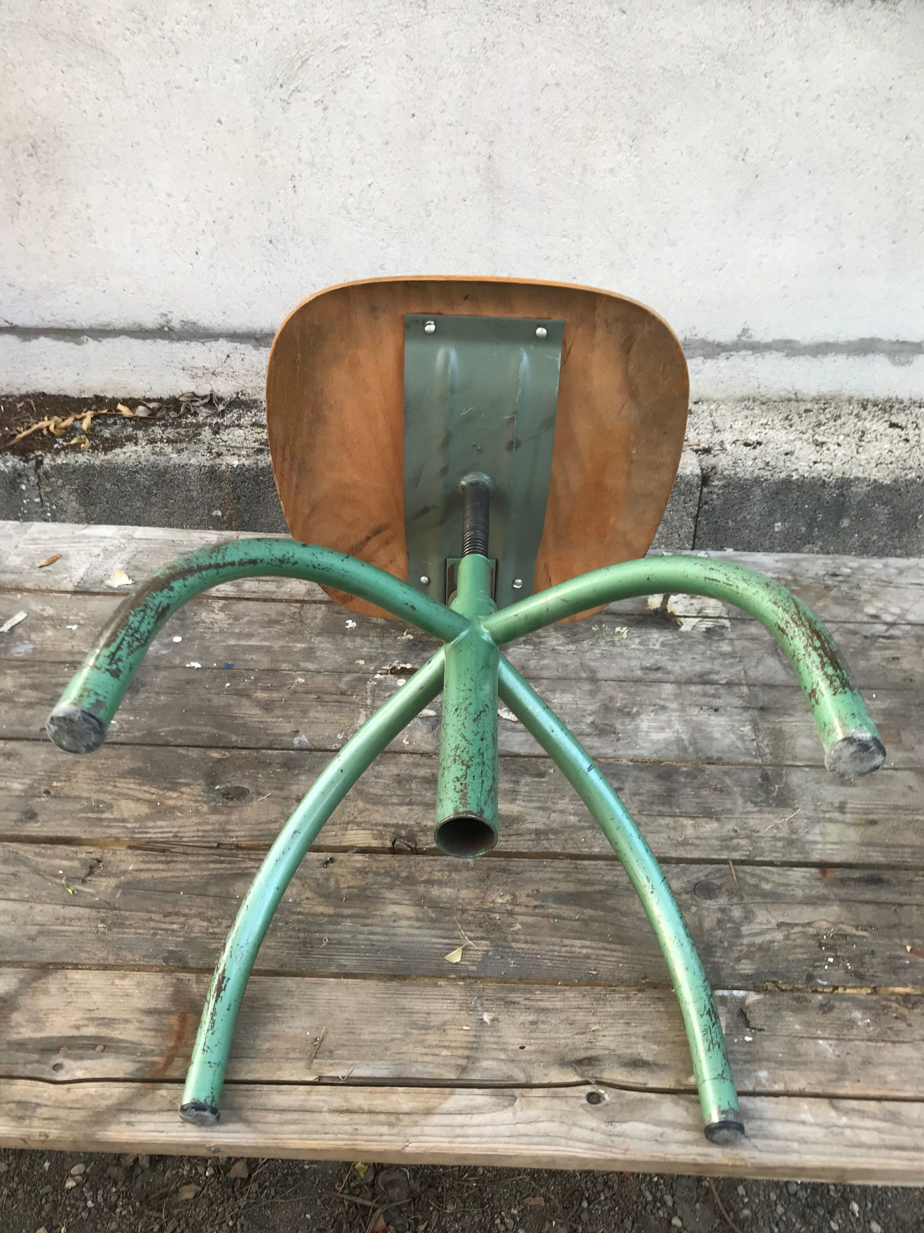 Former green metal workshop chair