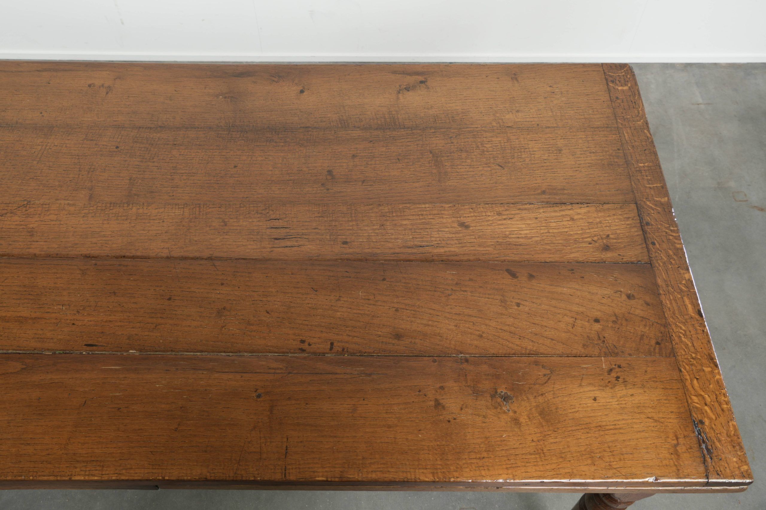 Antique oak dining table from the late 18th century with extendable leaves