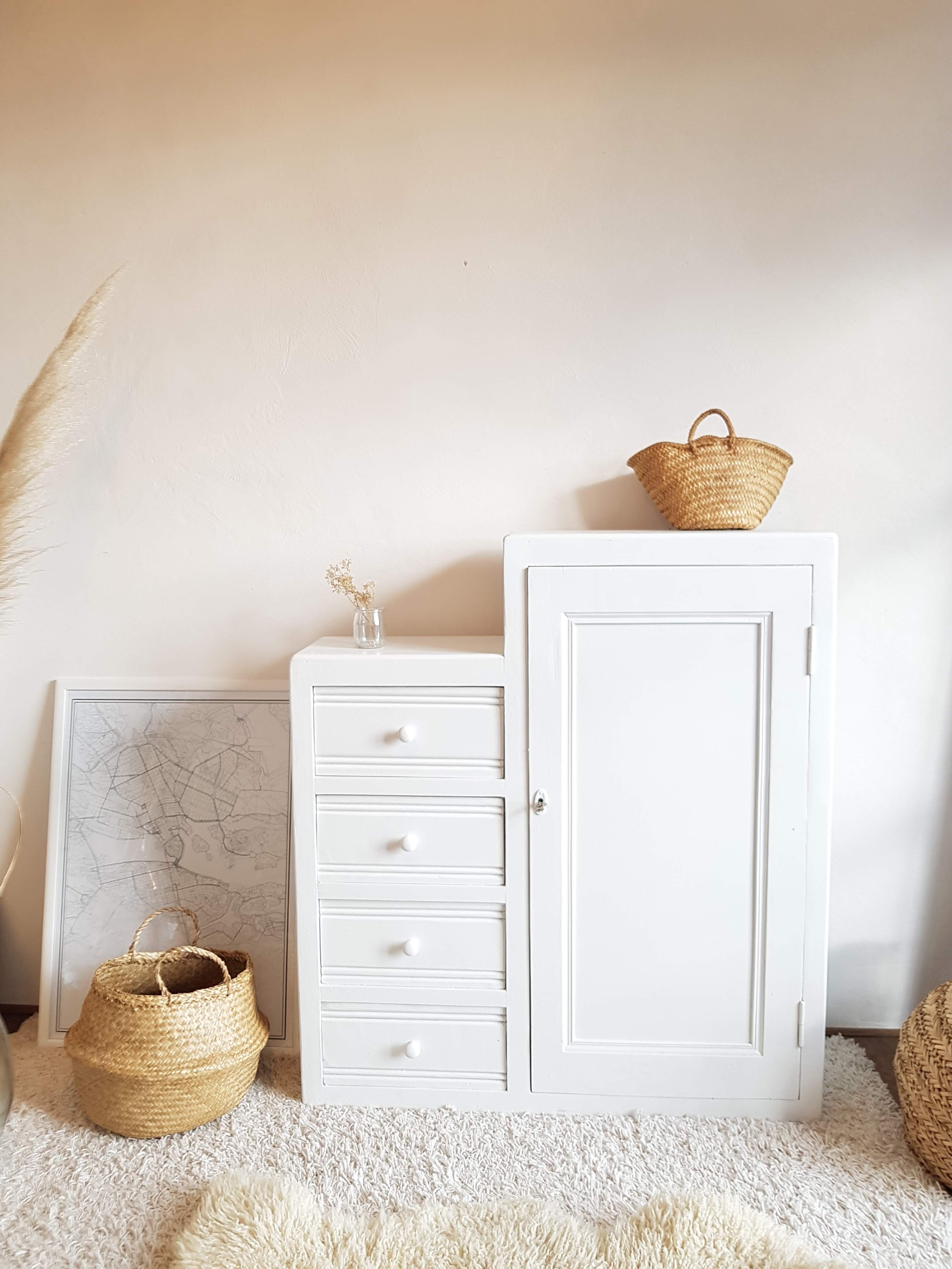 Old white asymmetrical chest of drawers