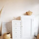 Old white asymmetrical chest of drawers