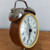 Vintage brown and silver mechanical alarm clock