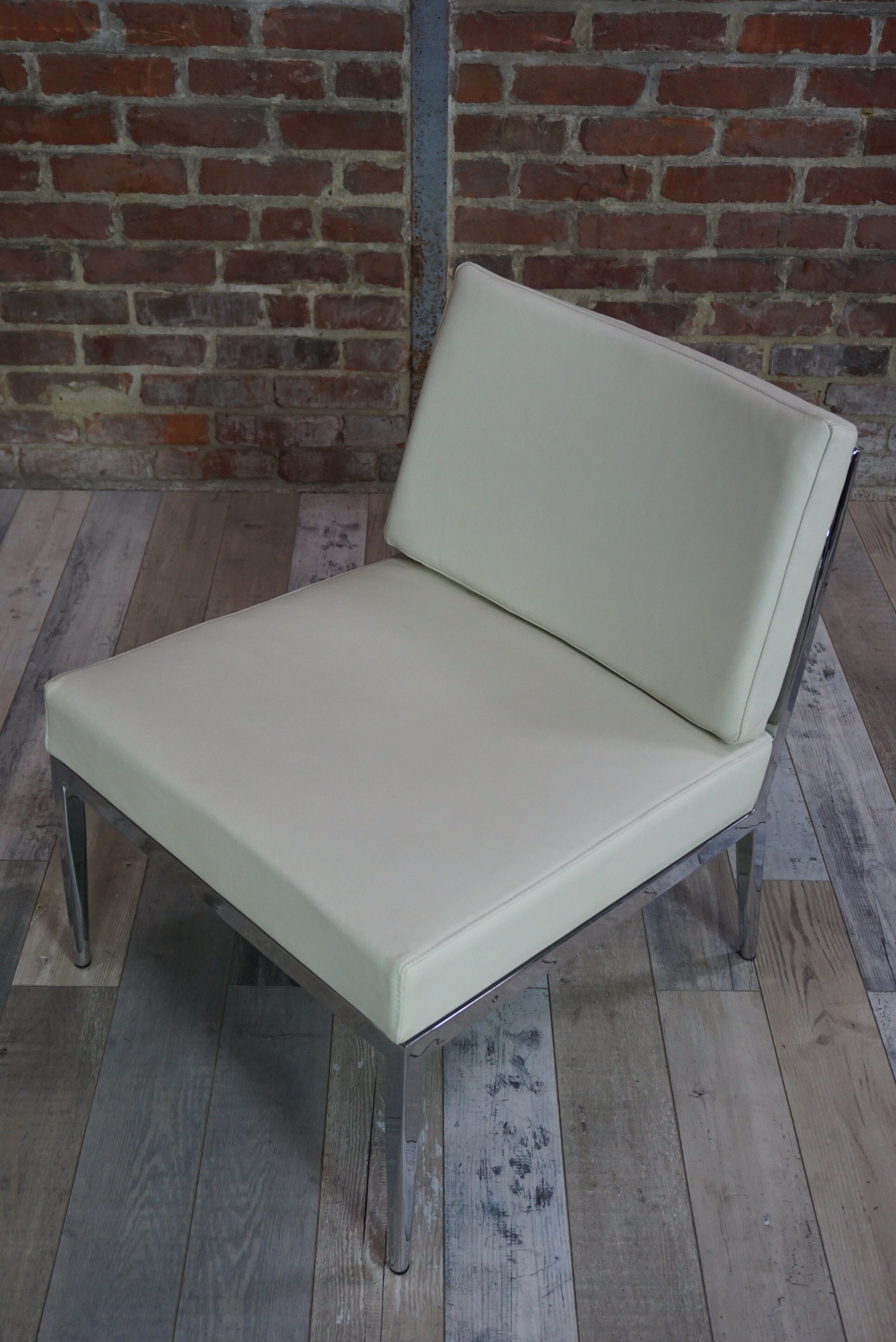 Pair of chrome and leather armchairs