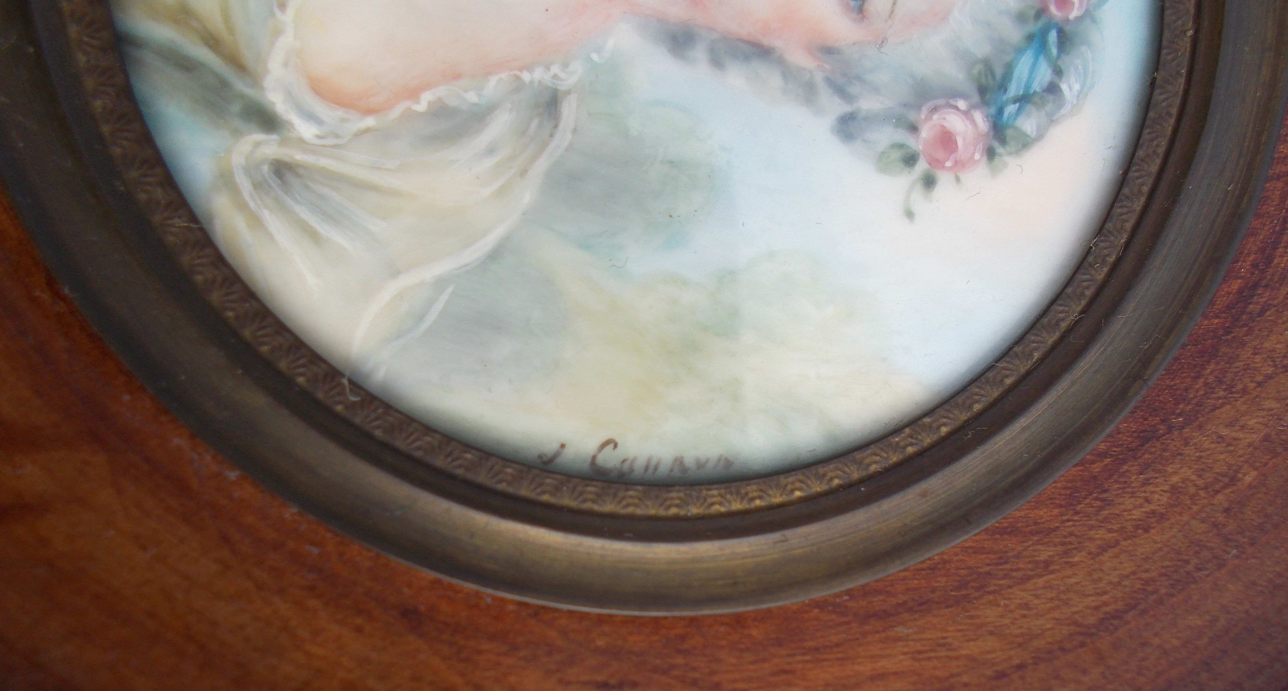 Miniature hand-painted portrait of a woman signed