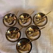 Set of 6 stainless steel ice cream bowls by Guy Degrenne with matching spoons.