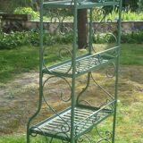 Folding green wrought iron shelf